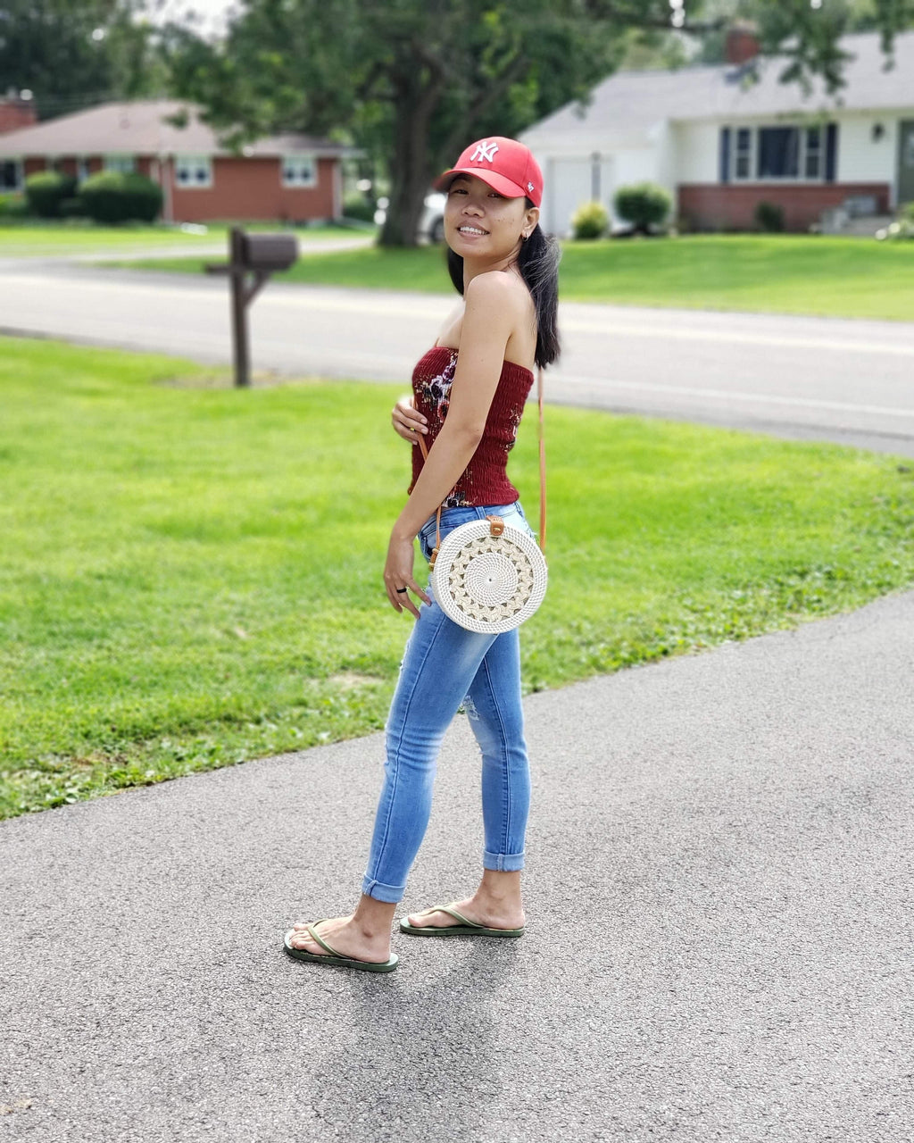 Our Best Seller Braided White Rattan Bag, hand made in Bali, Indonesia, shown on a Filipina model. 