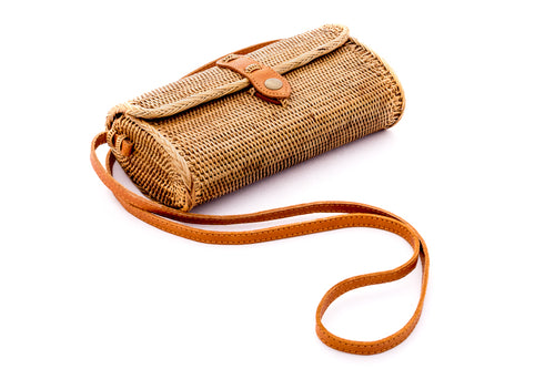 Natural rattan handbag with oval shape hand woven in Bali Indonesia with leather strap & brass clasp.