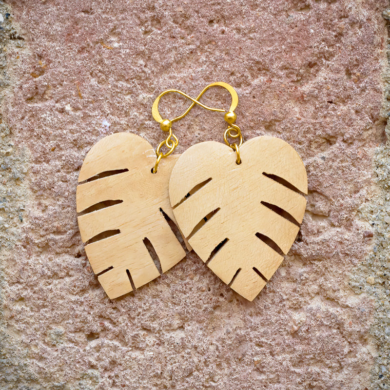 Coconut shell earrings hand carved in Philippines in tropical leaf pattern with brass hooks.