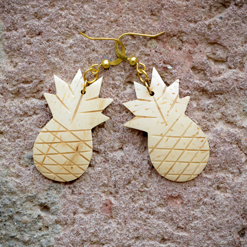 Coconut shell earrings hand carved in Philippines in pineapple pattern with brass hooks.