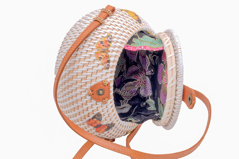 https://standpointamerica.com/cdn/shop/products/handmade-white-rattan-bag-Bali-potbelly-lining-1_800x.jpg?v=1628732495