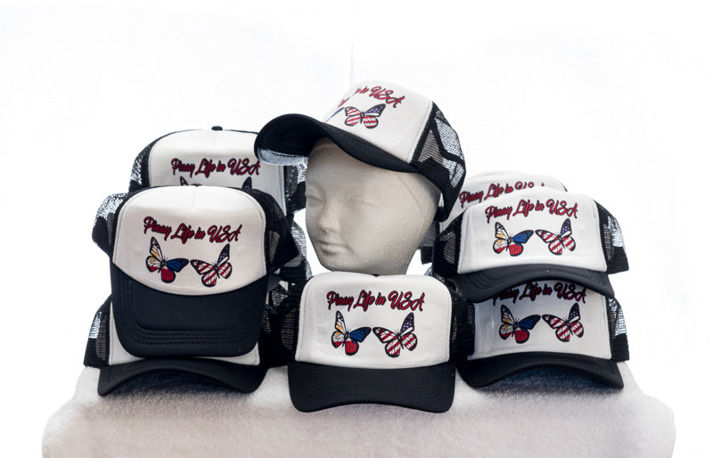 Group of Pinay Life in USA logo caps in black & white, showing group logo along with two butterflies in Philippines & American flag colors hand printed on front white panel.