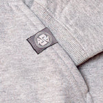 Cozy hoodie hand printed in Philippines, front view showing detail of cuff, pocket & logo