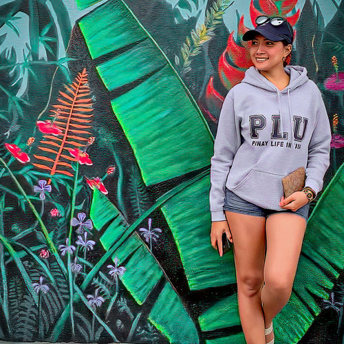 Heavy weight gray hoodie, front side, showing PLU logo & Pinay Life in USA text hand printed in black, pictured on female model.