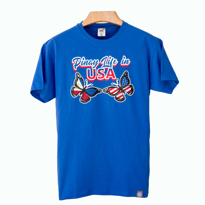 Blue PLU t-shirt showing Pinay Life in USA logo & two butterflies, hand printed in Philippines, in Philippines and American flag colors.