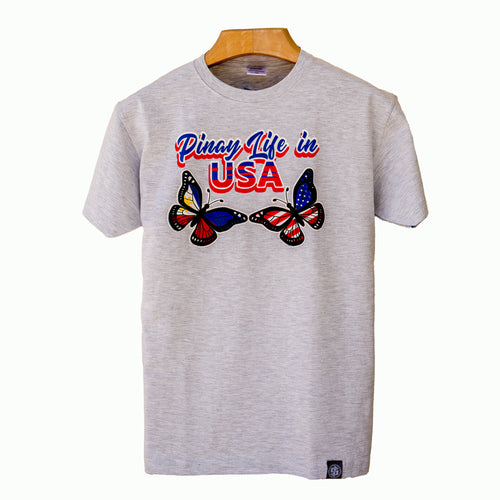 Gray PLU t-shirt showing Pinay Life in USA logo & two butterflies, hand printed in Philippines, in Philippines and American flag colors.